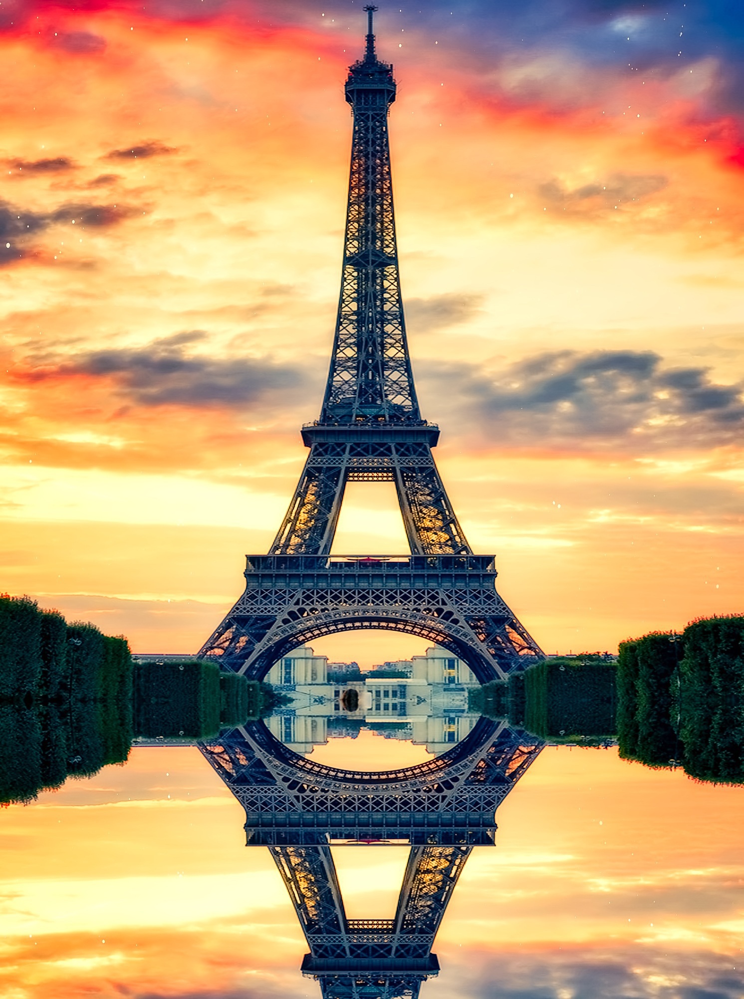 The Eiffel Tower rising above Paris at dusk
