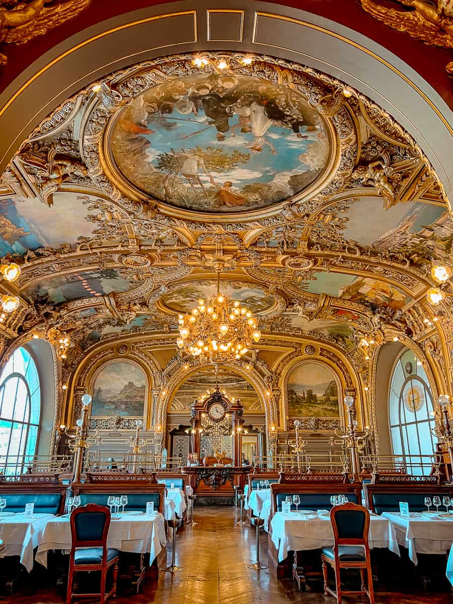 The opulent gilded interior of Le Train Bleu restaurant inside Gare de Lyon