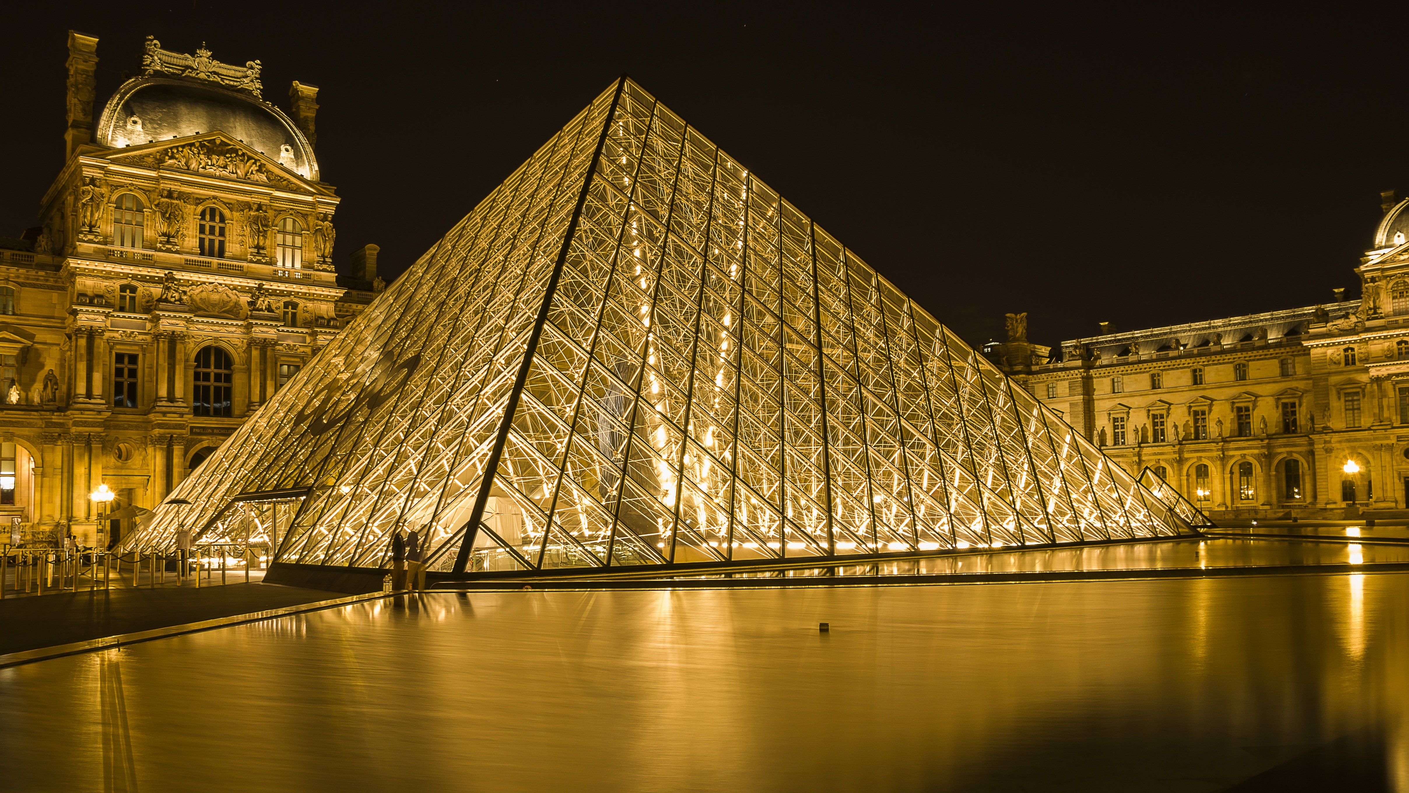The Louvre Museum courtyard with the iconic glass pyramid