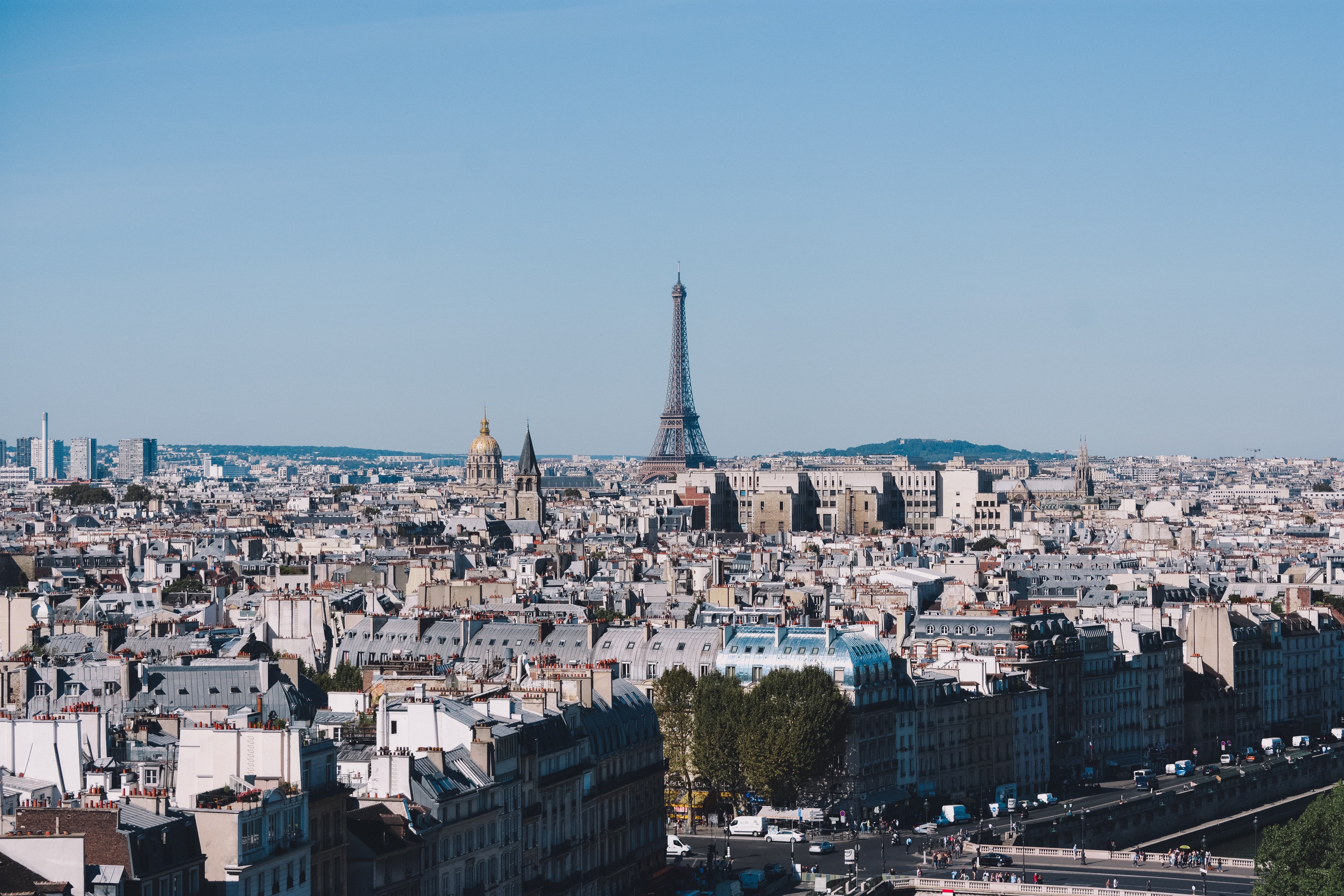 A daytime view of Paris with the Eiffel Tower in the distance